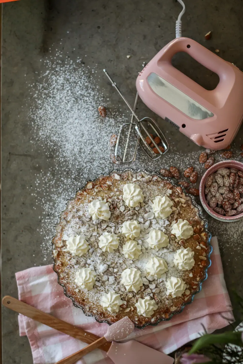 Baking ingredients and a freshly made cake