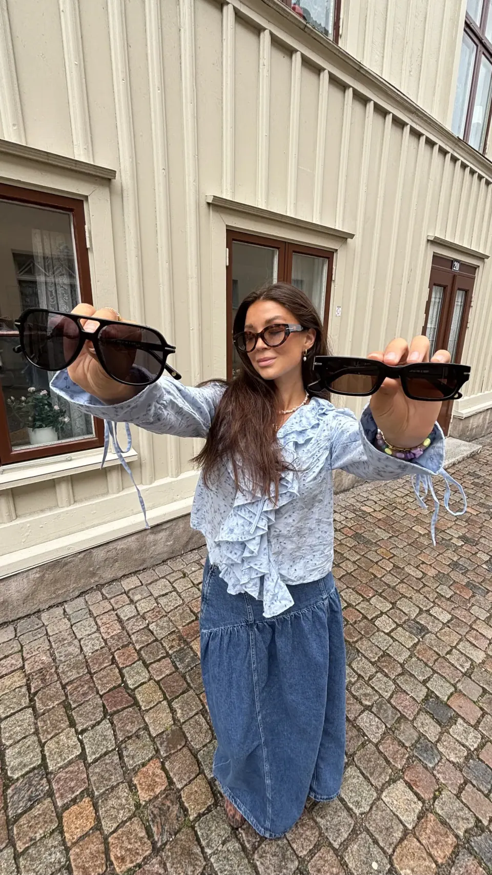 Creator showing sunglasses outdoors